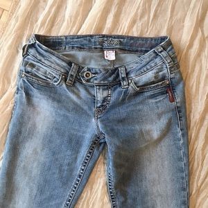 Silver distressed flares size 27